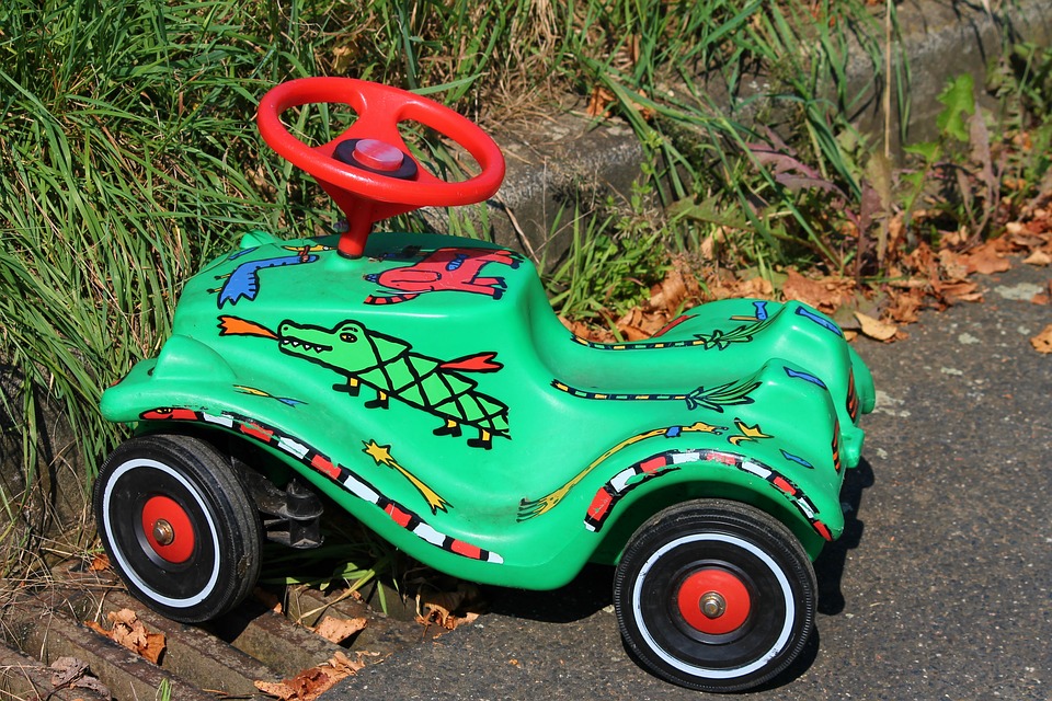toy car with fire breathing shoe wearing alligator painted on